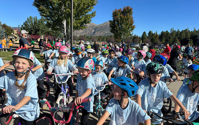 Bike-a-Thon photo of many children on bikes participating in the Fall 2024 event