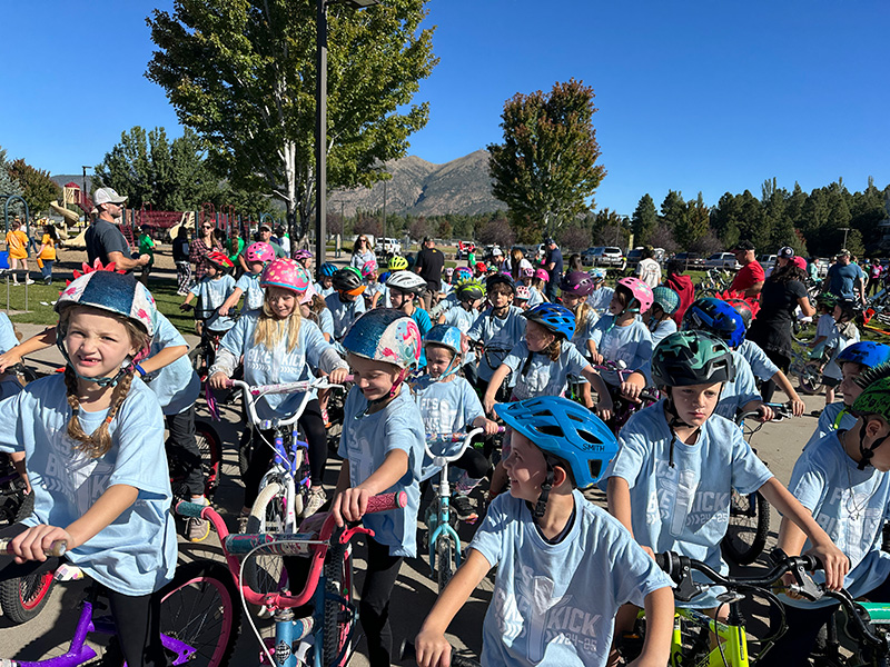 Bike-a-Thon photo of many children on bikes participating in the Fall 2024 event